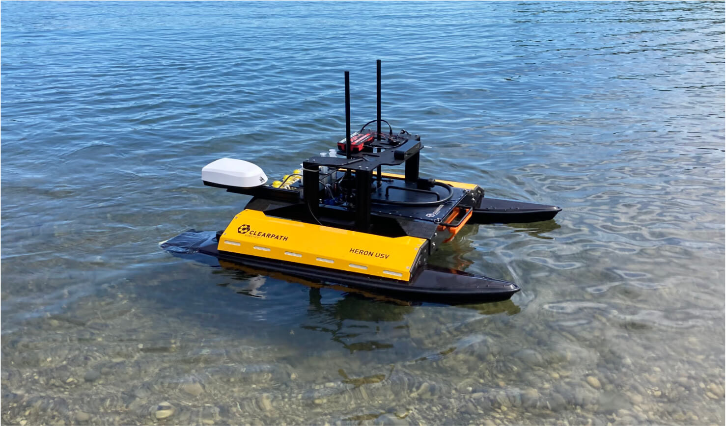 Clearpath Heron ASV in a lake.